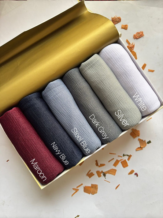 Crimped Moonlight Jersey Hijab by Aynn Alif in Maroon, Navy Blue, Steel Blue, Dark Grey, Silver, and White. Premium soft, breathable, lightweight textured jersey hijab for modest fashion in Pakistan.
