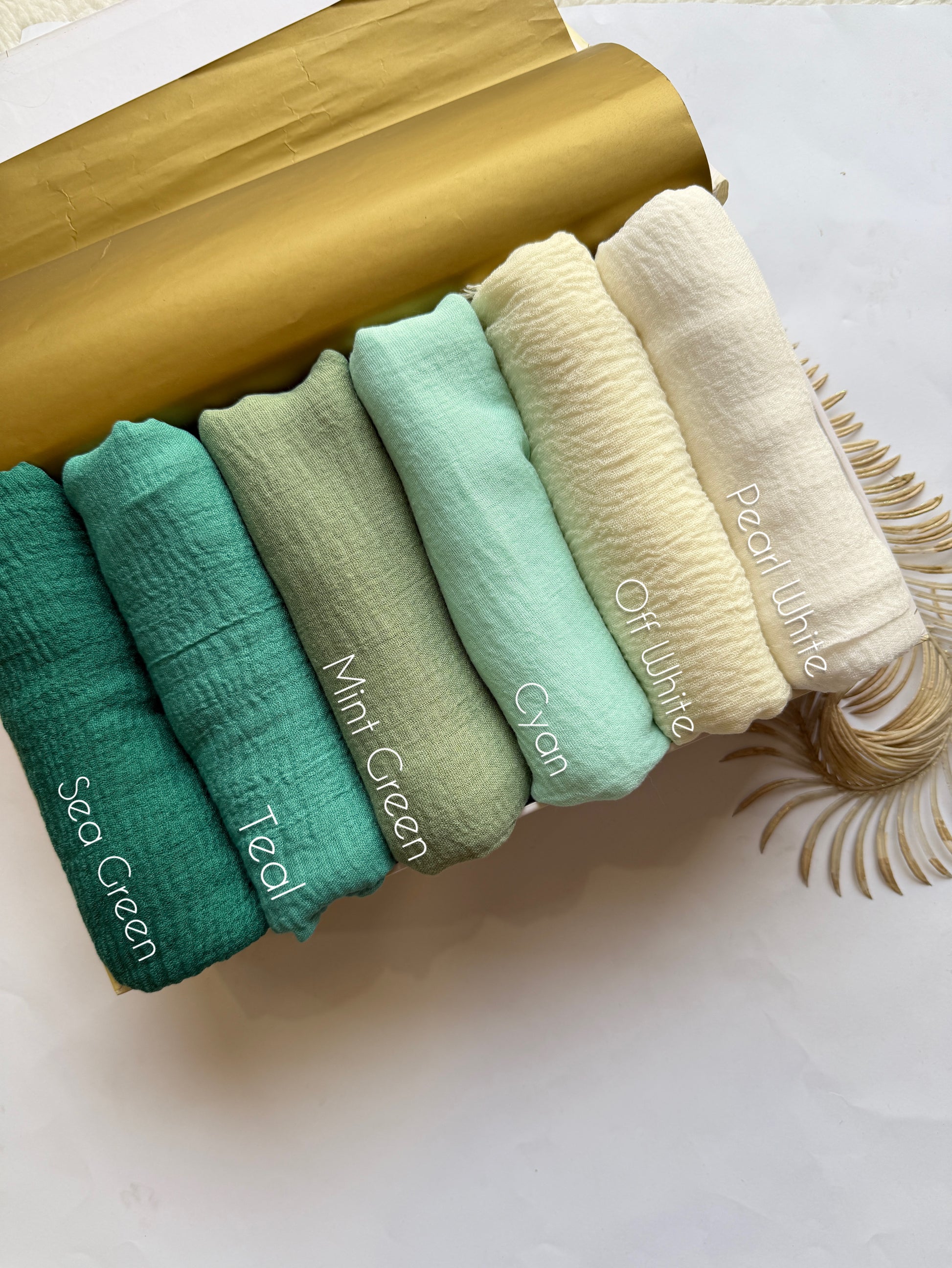 Aynn Alif crimp lawn hijab collection featuring sea green teal mint green cyan off white and pearl white breathable anti slip textured hijabs in Pakistan.