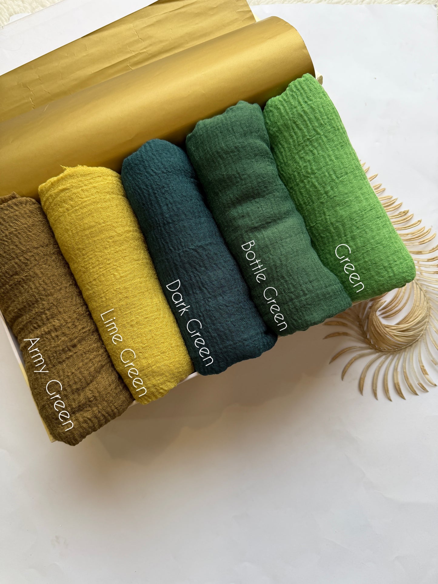 Aynn Alif green crimp lawn hijab collection featuring army green lime green dark green bottle green and green breathable anti slip textured hijabs in Pakistan.