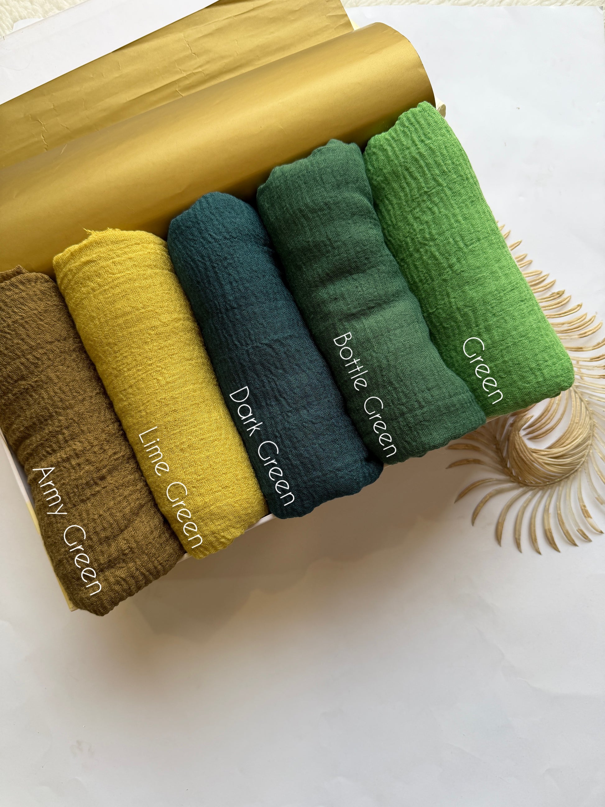 Aynn Alif green crimp lawn hijab collection featuring army green lime green dark green bottle green and green breathable anti slip textured hijabs in Pakistan.