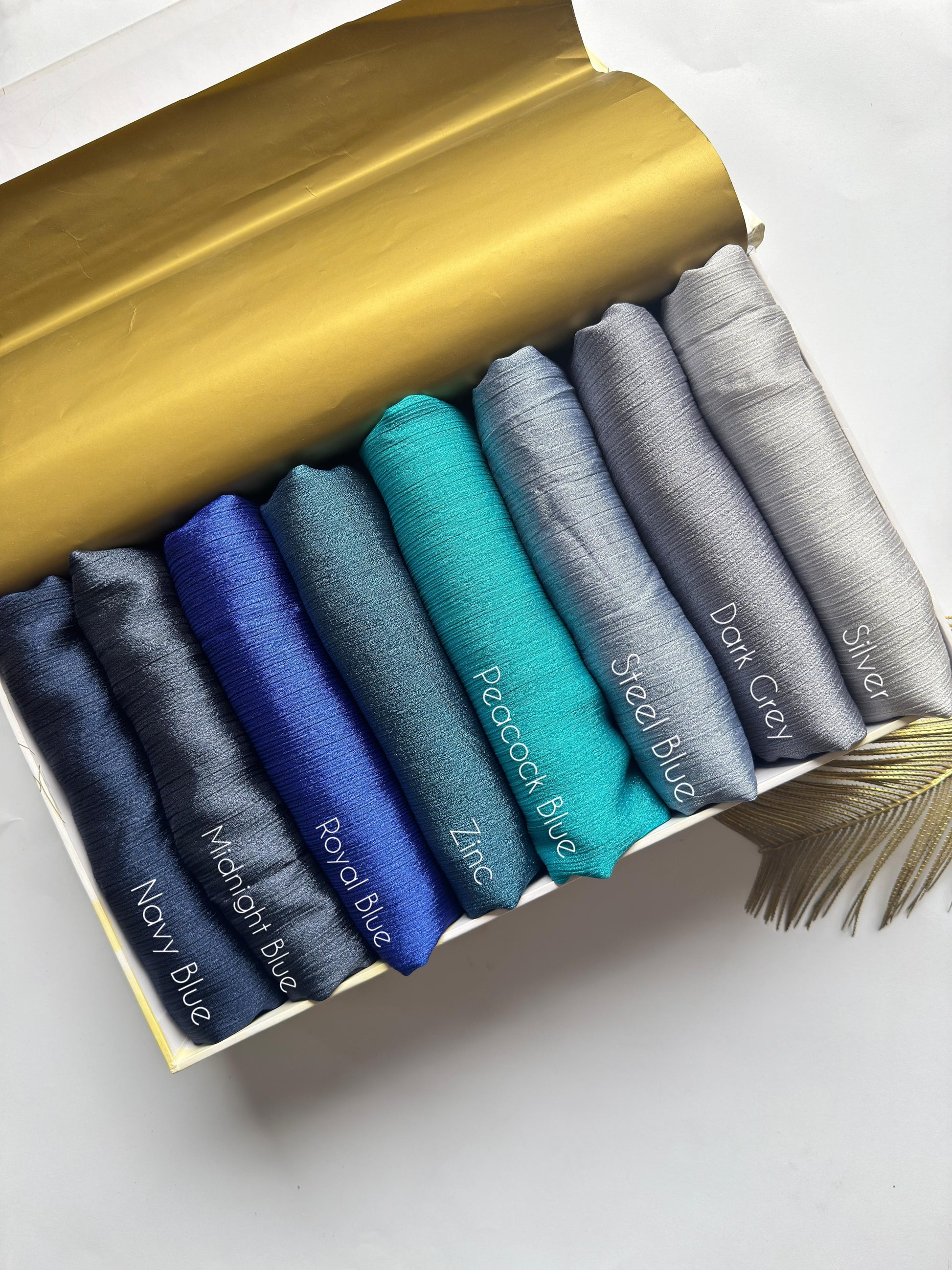 Crinkle Silk Hijab Ocean Mist Collection featuring Navy Blue, Midnight Blue, Royal Blue, Zinc, Peacock Blue, Steel Blue, Dark Grey and Silver shades.