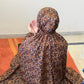 Dark brown floral namaz chaadar for women by Aynn Alif Pakistan with elastic sleeves, elastic headband, wudu-friendly design, breathable fabric, and full coverage prayer wear.