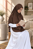 Girl wearing a dark brown Aynn Alif teens jersey makhna scarf with adjustable back elastic, designed for a comfortable and secure fit for ages 11–16.