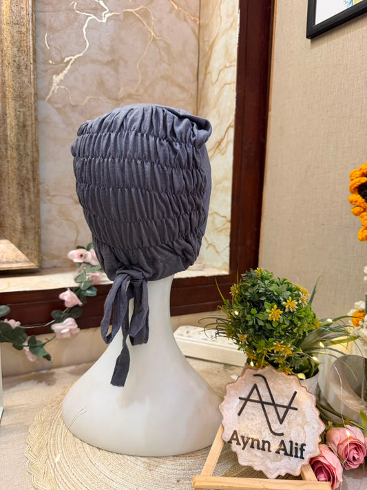 Dark Grey ruched tie back hijab cap made from soft breathable jersey with full head coverage and adjustable tie-back by Aynn Alif.
