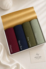 Aynn Alif large ribbed jersey hijabs in Maroon, Navy Blue, Army Green and Pista Green arranged in a white presentation box.