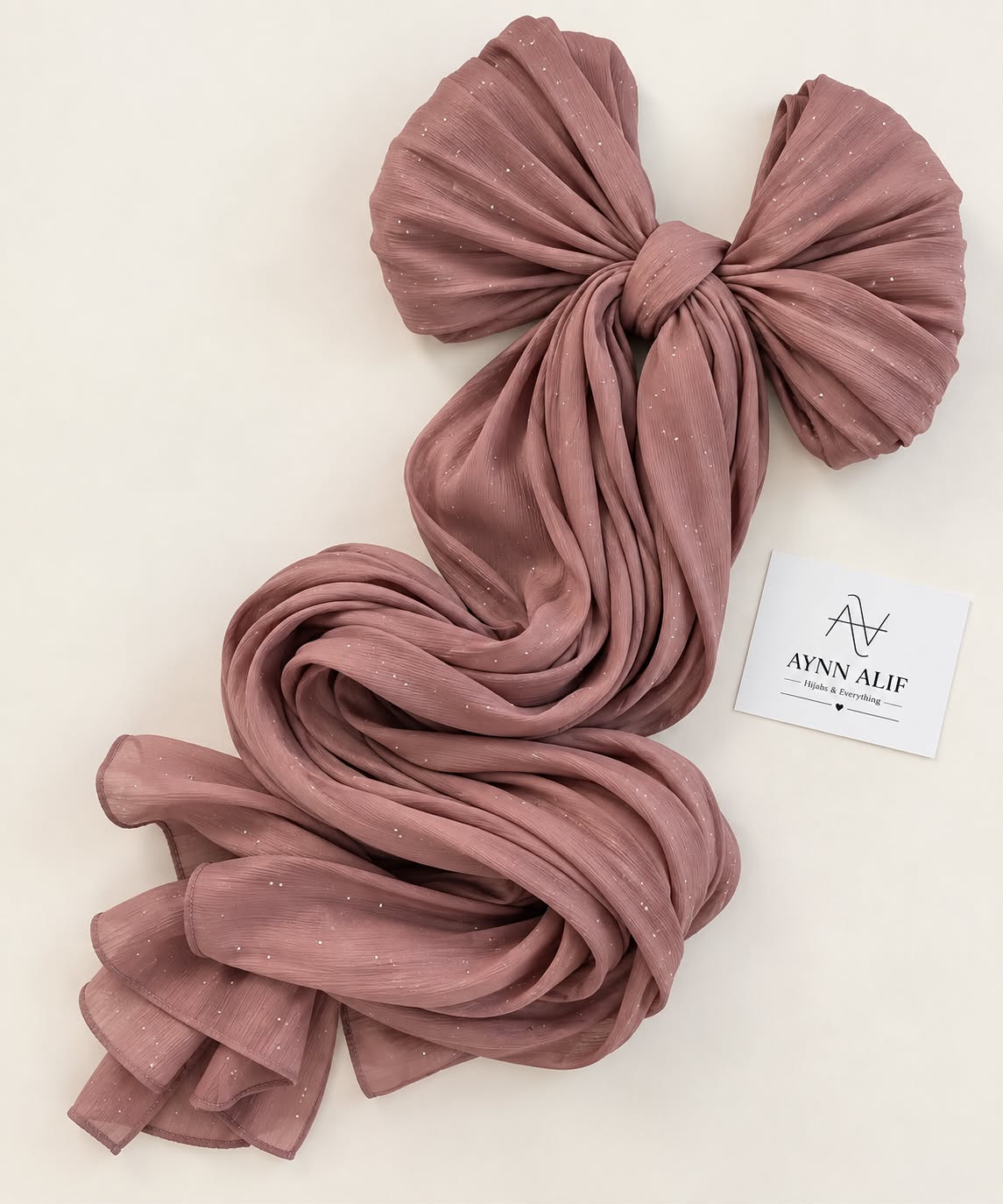 Dusky rose stones-studded matte silk hijab with a soft flowy drape and delicate embellishments by Aynn Alif