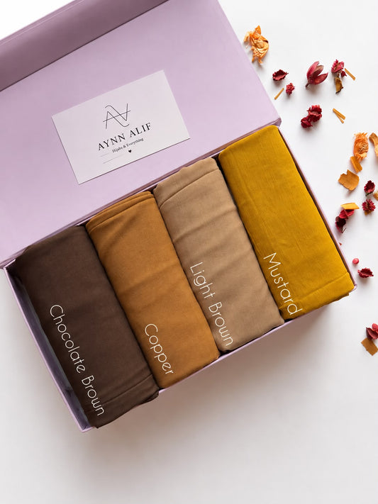Aynn Alif Earthy Essence Plain Lawn Hijab Box featuring Chocolate Brown, Copper, Light Brown and Mustard premium breathable lawn hijabs.