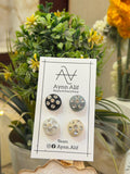 Black, grey, white and beige stone studded hijab magnets displayed on Aynn Alif card