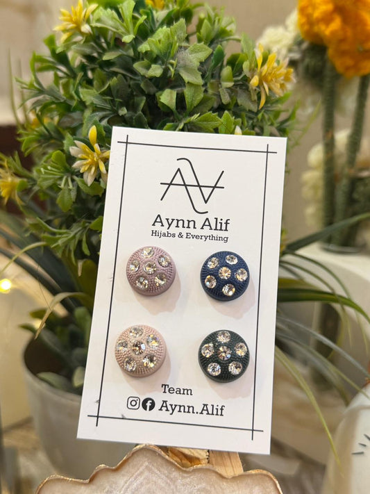 Stone studded hijab magnets in pink, navy, nude and green shades on display card by Aynn Alif