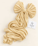 Gold stones-studded matte silk hijab with a soft, flowy drape and delicate stone embellishments by Aynn Alif.