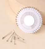 Silver pinwheel hijab pins featuring 30 metallic silver scarf pins for elegant hijab styling.