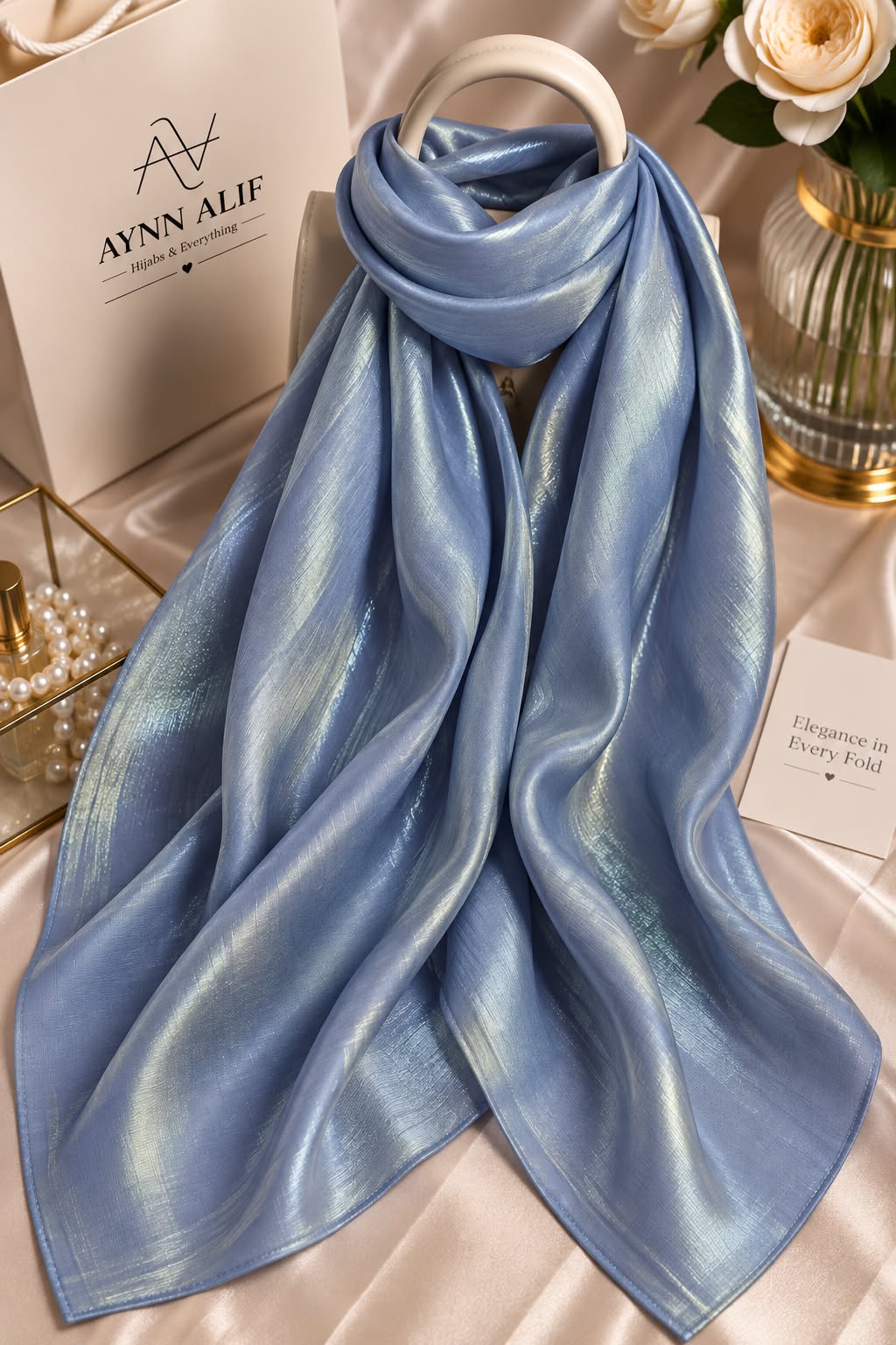Icy blue double tone sheen silk scarf with a luminous finish, smooth texture and elegant flowy drape by Aynn Alif.