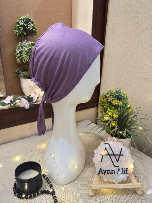 Lavender hijab cap displayed on mannequin