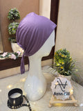 Lavender hijab cap displayed on mannequin