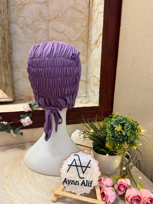 Lavender ruched tie back hijab cap made from soft breathable jersey with full head coverage and adjustable tie-back by Aynn Alif.