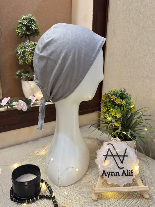 Light grey hijab cap displayed on mannequin