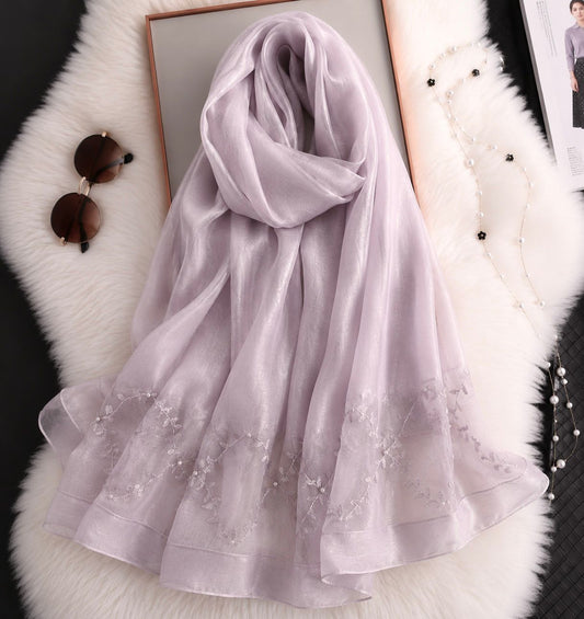 Light lavender cotton silk hijab with embroidered organza border and pearl detailing by Aynn Alif Pakistan.