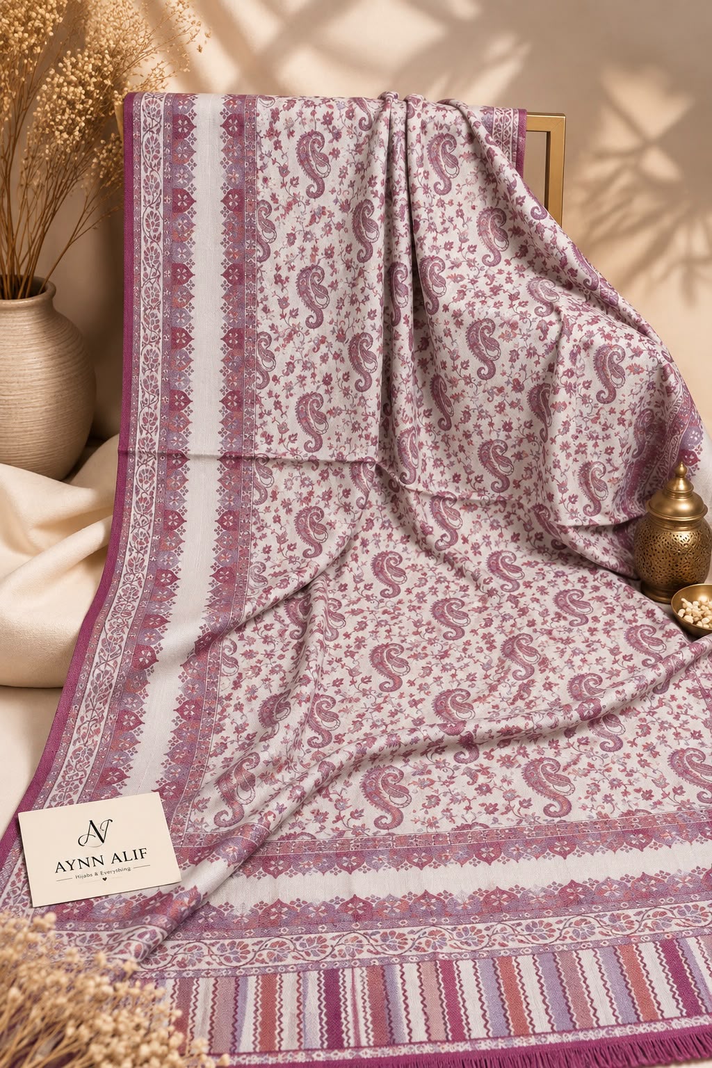 Magenta and ivory Kashmiri Kani shawl featuring intricate paisley motifs, delicate floral patterns and decorative borders by Aynn Alif Pakistan