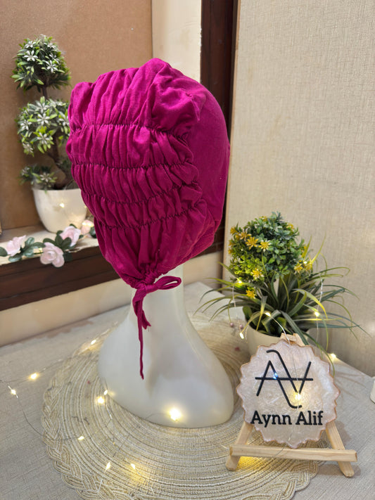 Shop the Magenta Pink Ruched Tie Back Hijab Cap by Aynn Alif. Soft breathable jersey, full head coverage, adjustable tie-back and secure non-slip fit.