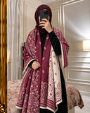 Maroon and ivory paisley reversible woolen wrap styled over a black modest outfit