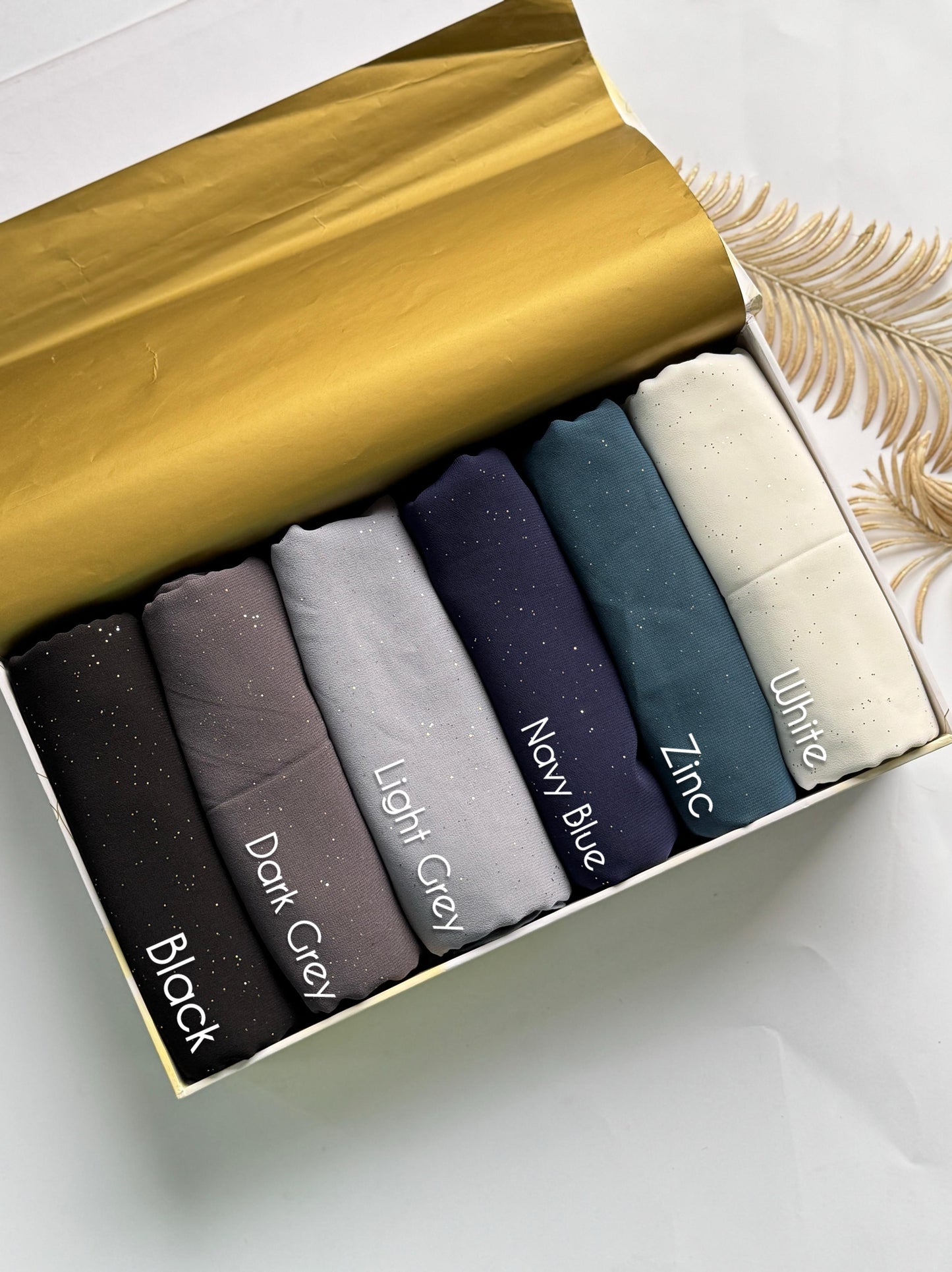 Aynn Alif glitter chiffon georgette hijab collection featuring Black, Dark Grey, Light Grey, Navy Blue, Zinc and White colours in Pakistan.