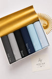 Aynn Alif plain jersey hijabs in Dark Grey, Light Grey, Black, Navy Blue, Sky Blue and Steel Blue arranged in a collection.
