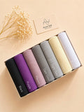 Large size Turkish lawn hijabs in Black, Purple, Mauve, Dark Grey, Light Grey, Cream, and White neatly arranged in a gift box by Aynn Alif.
