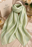 Mint green double tone sheen silk scarf with a luminous finish, smooth texture and elegant flowy drape by Aynn Alif.