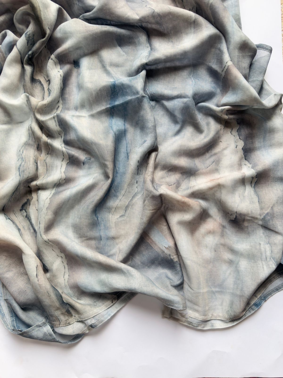 Arctic Mist Marble Modal Lawn Hijab in extra-large size featuring soft ivory, grey and blue watercolor marble print with a lightweight breathable drape.