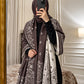 Mocha brown and ivory paisley reversible woolen wrap styled over a black modest outfit