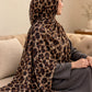 AYNN ALIF mocha leopard print modal lawn hijab in caramel beige and chocolate brown styled with a charcoal grey outfit.