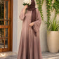 Mocha rose ombre front open abaya in Silk Korean Nidah with straight sleeves and matching scarf, styled with a brown hijab in an elegant outdoor setting.