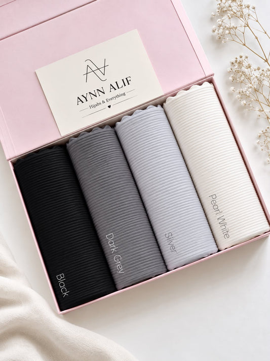 Monochrome Luxe Ribbed Jersey Hijab Box featuring Black, Slate Grey, Pearl Grey and Ivory White premium anti-slip narrow ribbed jersey hijabs in a luxury gift box