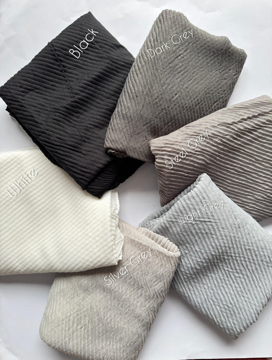 Bubble pleated lawn hijabs by Aynn Alif Pakistan in black, grey and white monochrome shades with lightweight breathable fabric for modest styling.