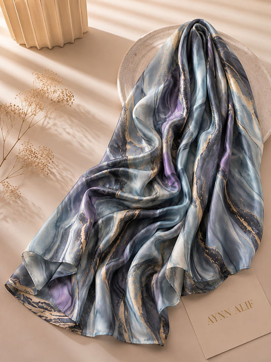 Aynn Alif Moonstone Marble Modal Lawn Hijab in misty blue, charcoal grey, lavender and gold marble print, extra large, breathable and soft.