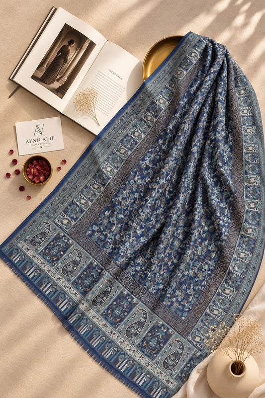 Aynn Alif Kashmiri Kani mini shawl in navy blue and dusty blue featuring intricate ornamental patterns, decorative borders, and delicate ivory accents, styled as a versatile wrap or scarf.