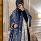 Navy blue and ivory paisley reversible woolen wrap styled over a black modest outfit
