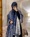Navy blue and ivory paisley reversible woolen wrap styled over a black modest outfit