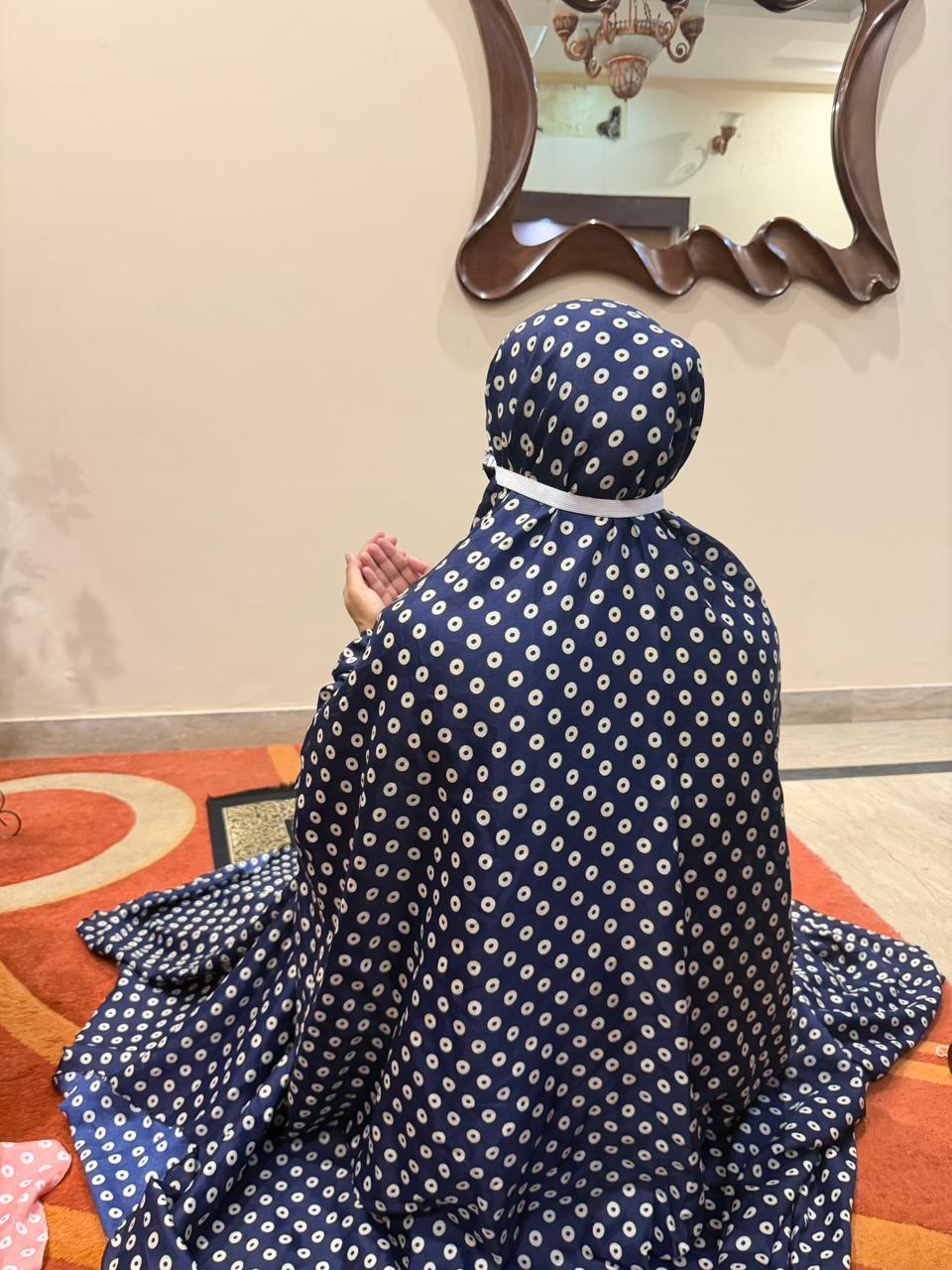 Navy blue namaz chaadar with beige rings by Aynn Alif Pakistan featuring elastic sleeves, elastic headband, wudu-friendly design, breathable fabric, and full coverage prayer wear for women.