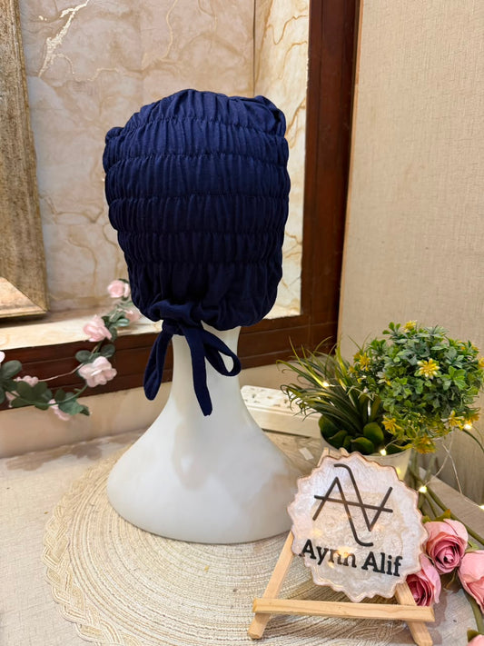 Navy Blue ruched tie back hijab cap made from soft breathable jersey with full head coverage and adjustable tie-back by Aynn Alif.