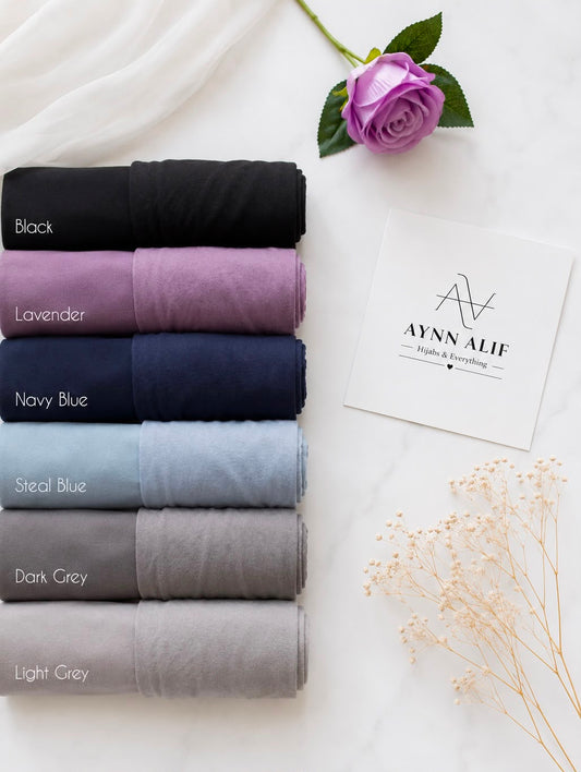 
Aynn Alif chiffon georgette hijabs with matching jersey tube bands in Black, Lavender, Navy Blue, Steal Blue, Dark Grey and Light Grey.