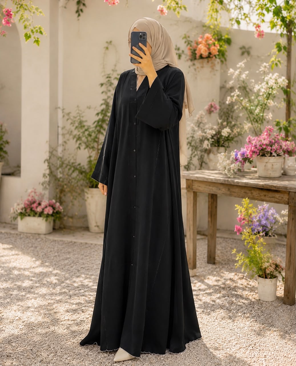 Black button-down Nidah abaya with one-side stone embellishments, embellished sleeves and matching scarf by Aynn Alif Pakistan.