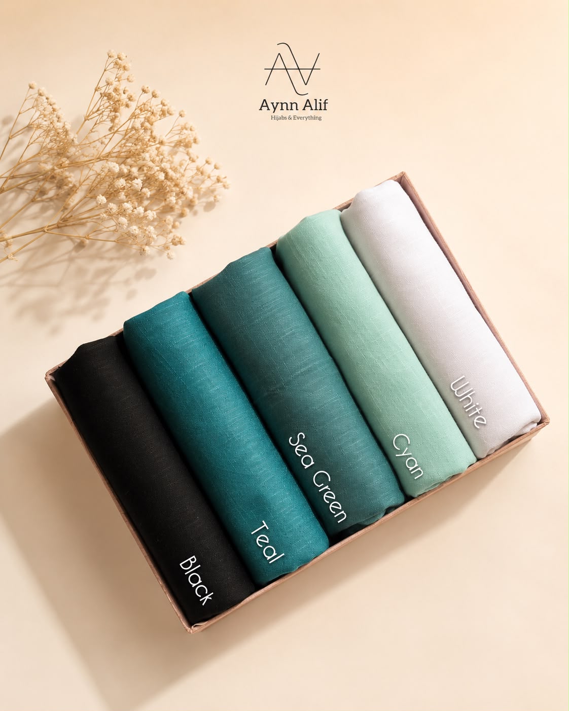 Ocean Breeze Turkish lawn hijabs in standard size featuring black, teal, sea green, cyan and white shades in breathable lightweight fabric.