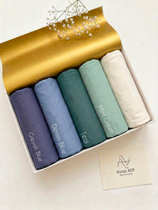 Shop Turkish Plain Jersey Hijabs by Aynn Alif in Pakistan. Extra-large 76×34 inch hijabs in blue, teal, mint and pearl white for generous coverage.
