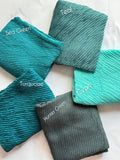 Bubble pleated lawn hijabs by Aynn Alif Pakistan in hunter green, teal, turquoise and cyan shades with lightweight breathable fabric for modest styling