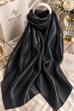 Onyx black double tone sheen silk scarf with subtle tonal sheen, smooth texture and elegant flowy drape by Aynn Alif.