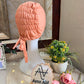 Orangish Peach ruched tie back hijab cap made from soft breathable jersey with full head coverage and adjustable tie-back by Aynn Alif.