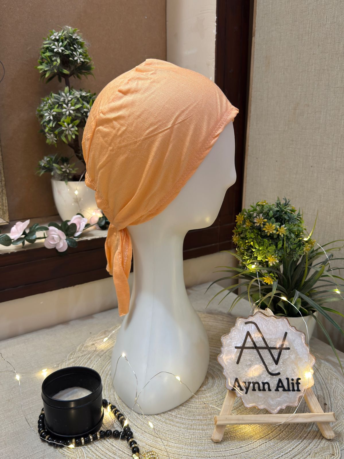 Peach plain hijab cap on mannequin