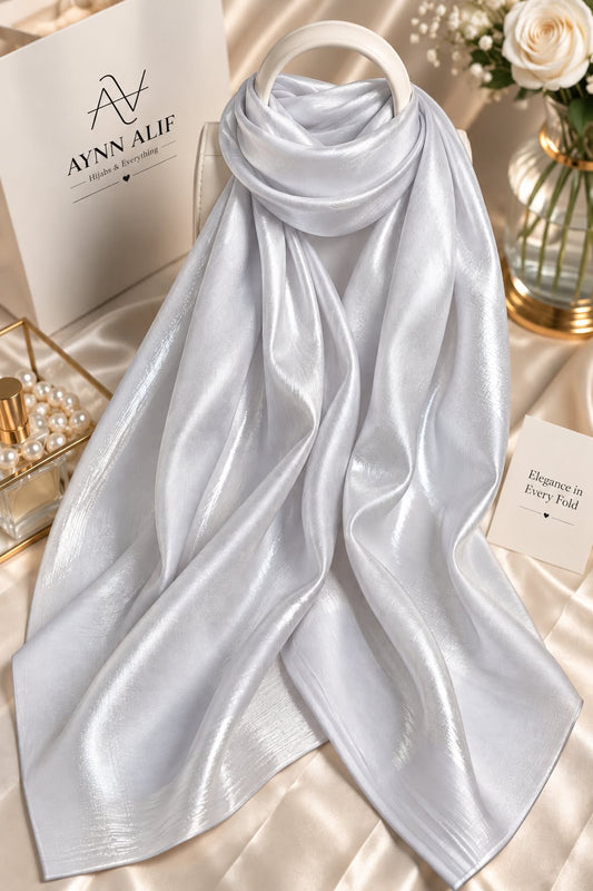 Pearl silver double tone sheen silk scarf with a luminous finish, smooth texture and elegant flowy drape by Aynn Alif.