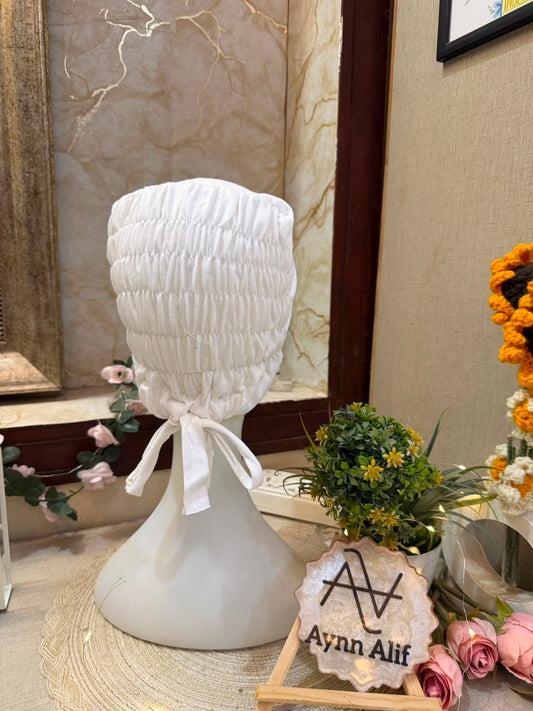 Pearl White ruched tie back hijab cap made from soft breathable jersey with full head coverage and adjustable tie-back by Aynn Alif.